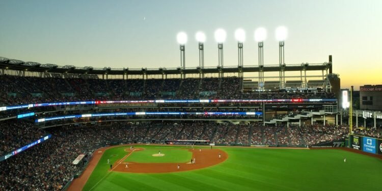 A vibrant twilight baseball game at Cleveland's Progressive Field, capturing the lively atmosphere.